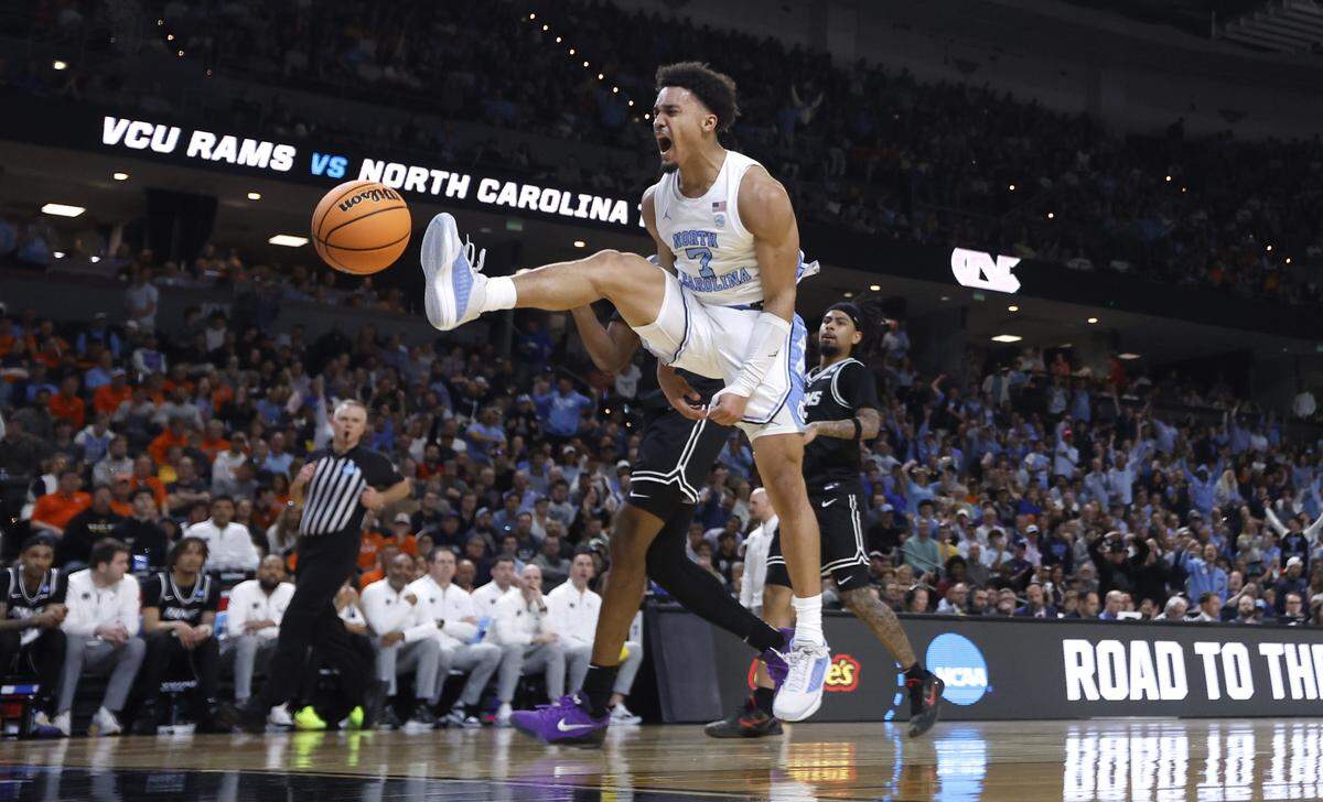North Carolina's Seth Trimble (7) celebrates after slamming in two during the first half of UNC’s game against VCU in the first round of the NCAA Men’s Basketball Tournament at  Bon Secours Wellness Arena in Greenville, S.C., Thursday, March 19, 2026.