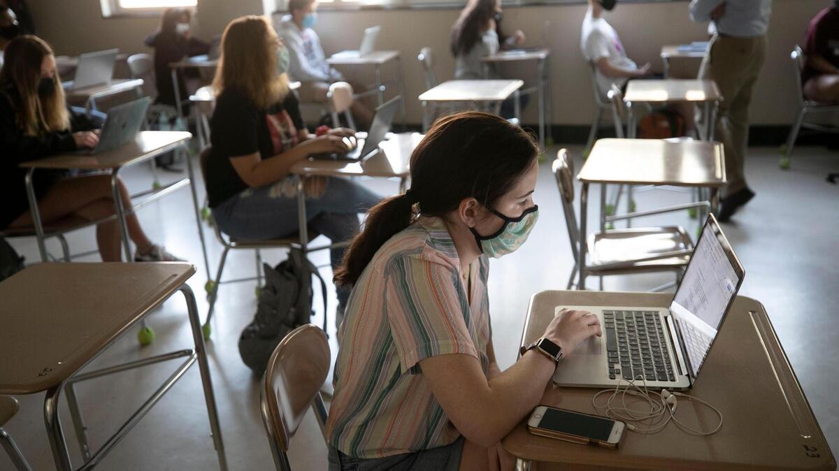 Broughton High School student Maggie Montgomery attends Marlin Jones’ American History class on Thursday, April 8, 2021 in Raleigh, N.C.