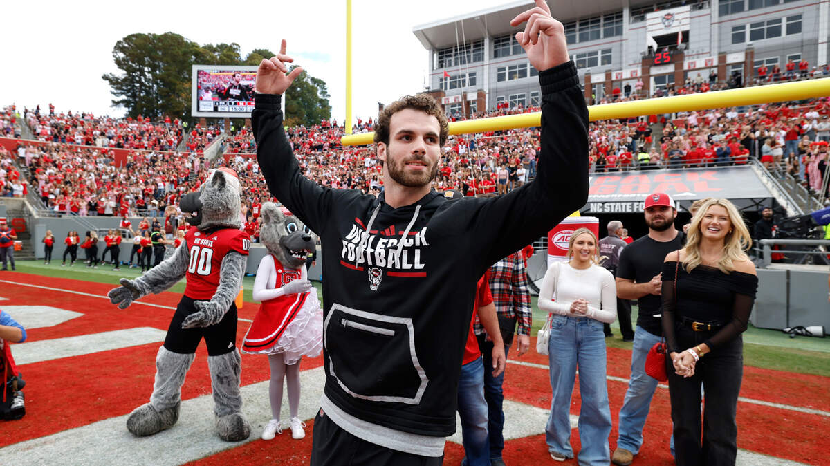 Former N.C. State linebacker Payton Wilson acknowledges the crowd as he introduced before his number was added to the ring of honor during the first half of N.C. State’s game against Stanford at Carter-Finley Stadium in Raleigh, N.C., Saturday, Nov. 2, 2024.