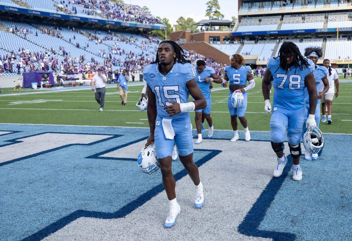 North Carolina quarterback Conner Harrell (15) leaves the field following the Tar Heels’ 70-50 loss to James Madison on Saturday, September 21, 2024 at Kenan Stadium in Chapel Hill, N.C. Harrell played only one down for a loss of three yards and a fumble.