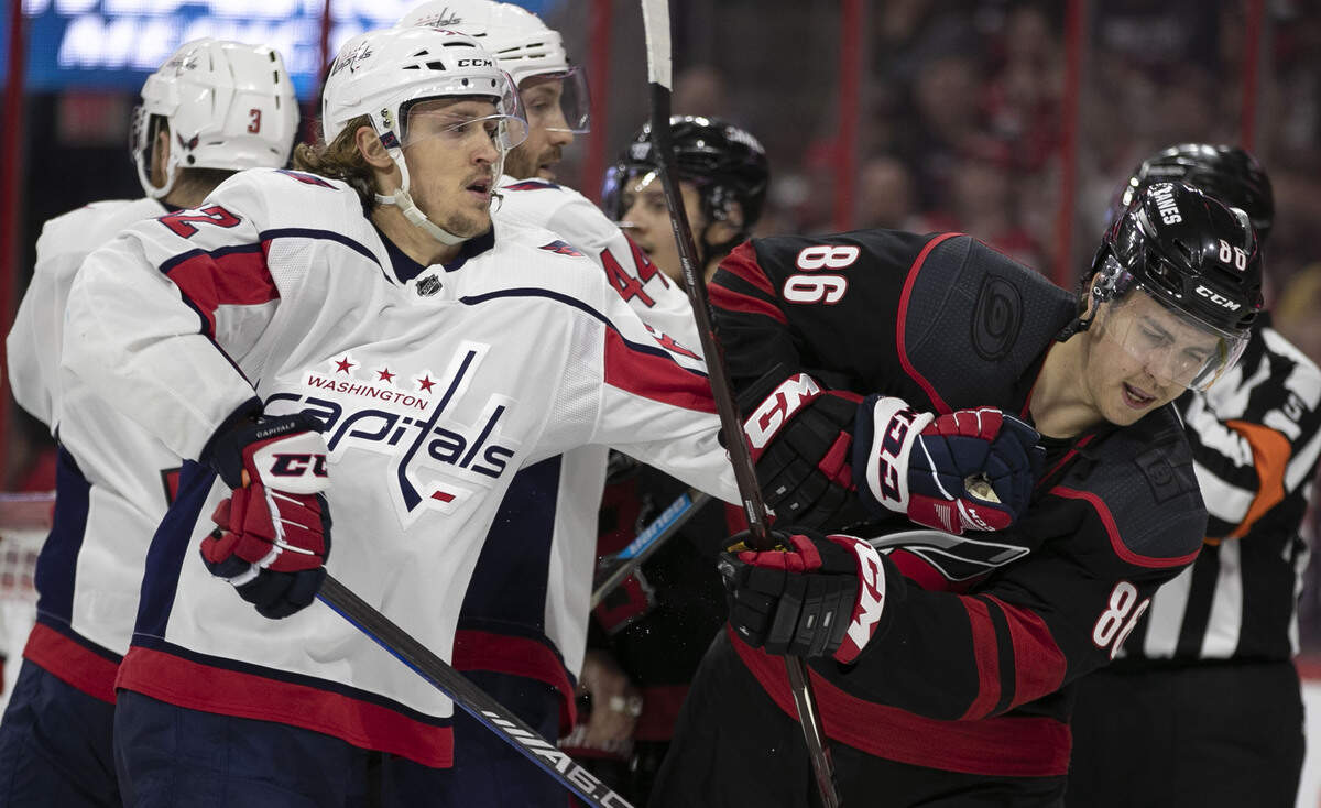 Carolina Hurricanes forward Teuvo Teravainen (86) takes a hit from Washington Capitals defenseman Brooks Orpik (44) in the second period during Game 6 of their first round Stanley Cup series on Monday, April 22, 2019 at PNC Arena in Raleigh, N.C.