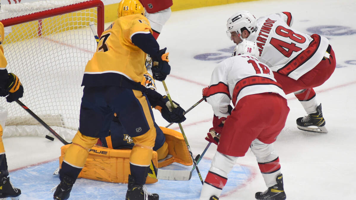 Carolina Hurricanes left wing Jordan Martinook (48) scores a goal against the Nashville Predators in the first period of a preseason NHL hockey game Saturday, Oct. 9, 2021, in Nashville, Tenn. (AP Photo/Mike Strasinger)