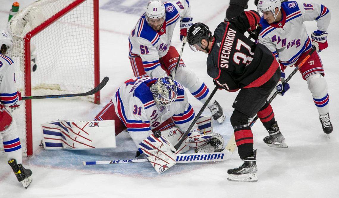 New York Rangers goalie Igor Shesterkin (31) stops a scoring attempt by Carolina Hurricanes Andrei Svechnikov (37) in the first period on Monday, May 30, 2022 during game seven of the Stanley Cup second round at PNC Arena in Raleigh, N.C.
