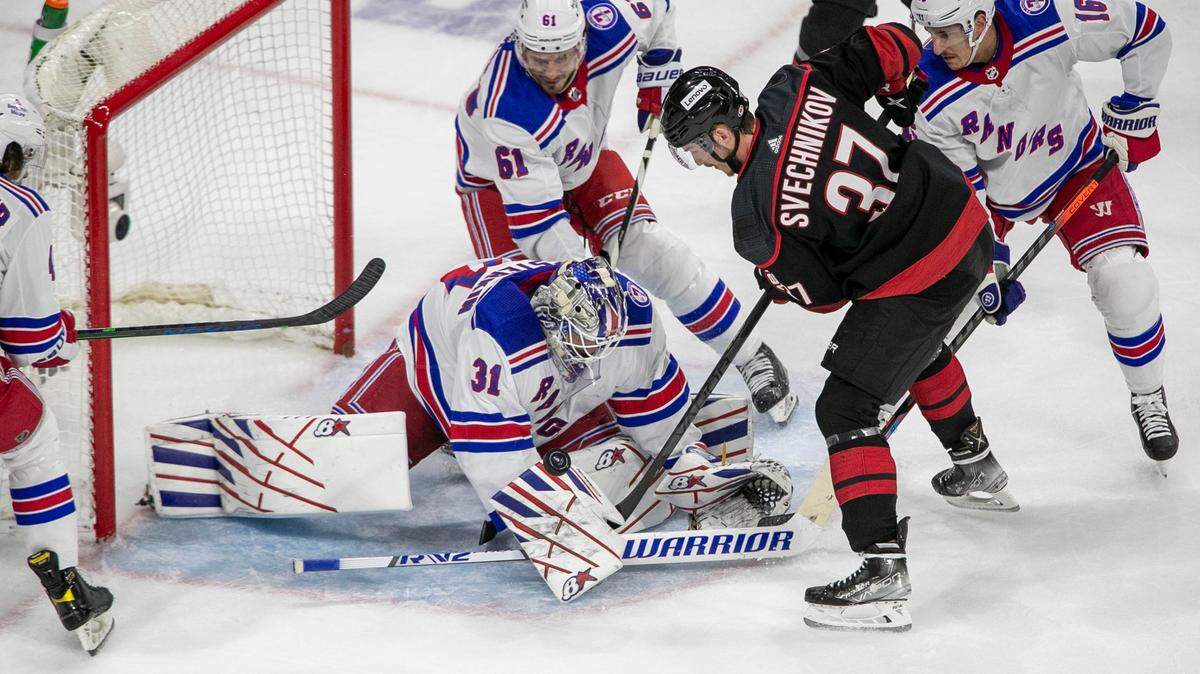 New York Rangers goalie Igor Shesterkin (31) stops a scoring attempt by Carolina Hurricanes Andrei Svechnikov (37) in the first period on Monday, May 30, 2022 during game seven of the Stanley Cup second round at PNC Arena in Raleigh, N.C.
