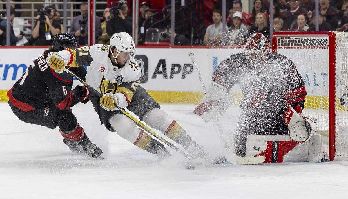 Vegas center Brett Howden (21) tries to score on Carolina Hurricanes goalie Frederik Andersen (31) in the second period during Game 2 of the Stanley Cup Final, on Thursday, June 4, 2026 at Lenovo Center in Raleigh, N.C. 