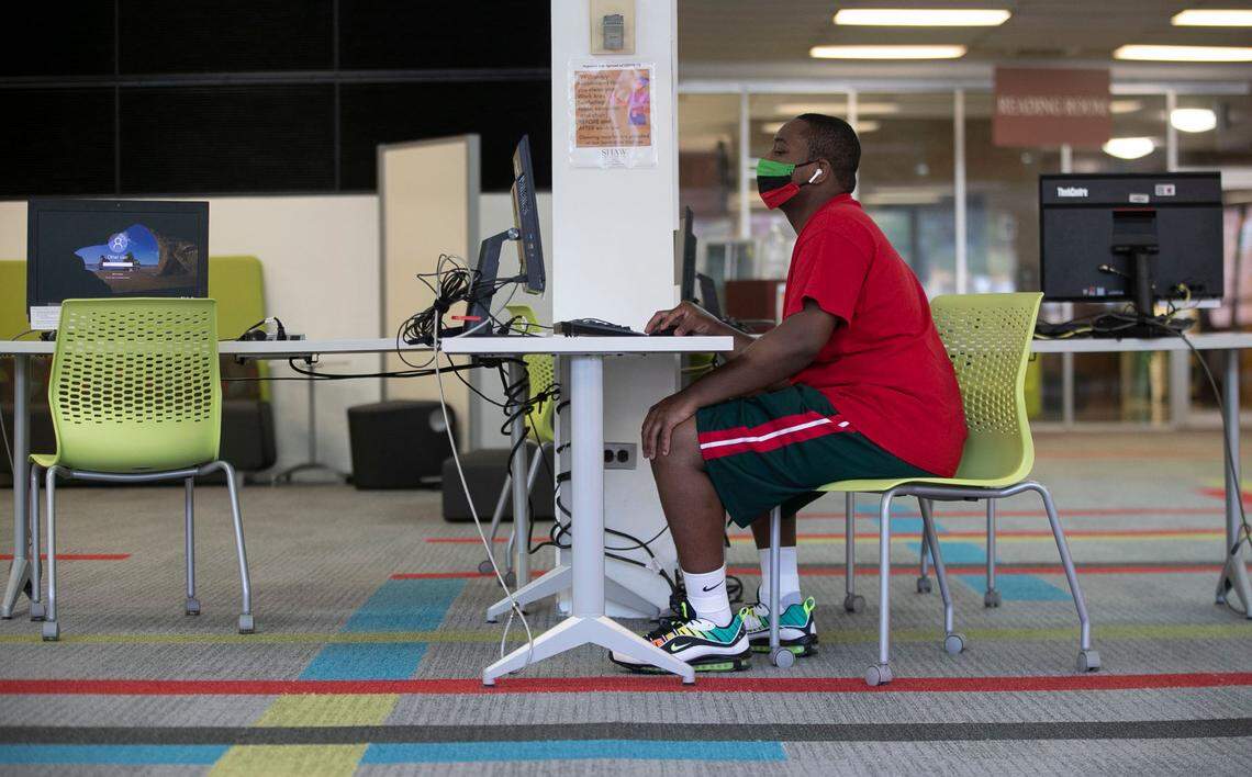 Shaw University senior biology major Jalil Hamilton users a computer in the library on campus on Tuesday, August 11, 2020 in Raleigh, N.C. Shaw will begin classes on August 12 amid the COVID-19 pandemic, with only about 50 percent of their student population on campus.