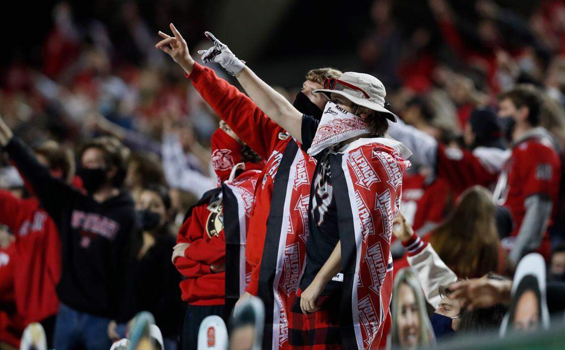 Wolfpack fans cheer on the team during the first half of N.C. State’s game against Florida State at Carter-Finley Stadium in Raleigh, N.C., Saturday, Nov. 14, 2020.
