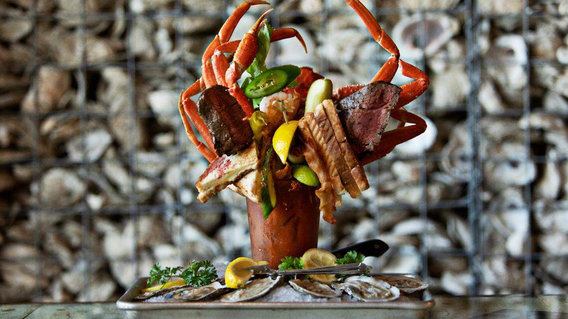 Zeus is one of Ultimate Bloody Mary’s on the cocktail menu at The Blind Pelican in Holly Springs. It includes shrimp, bacon, grilled cheese, lobster tail, a full pound of crab legs, a 6oz. filet mignon and oysters.