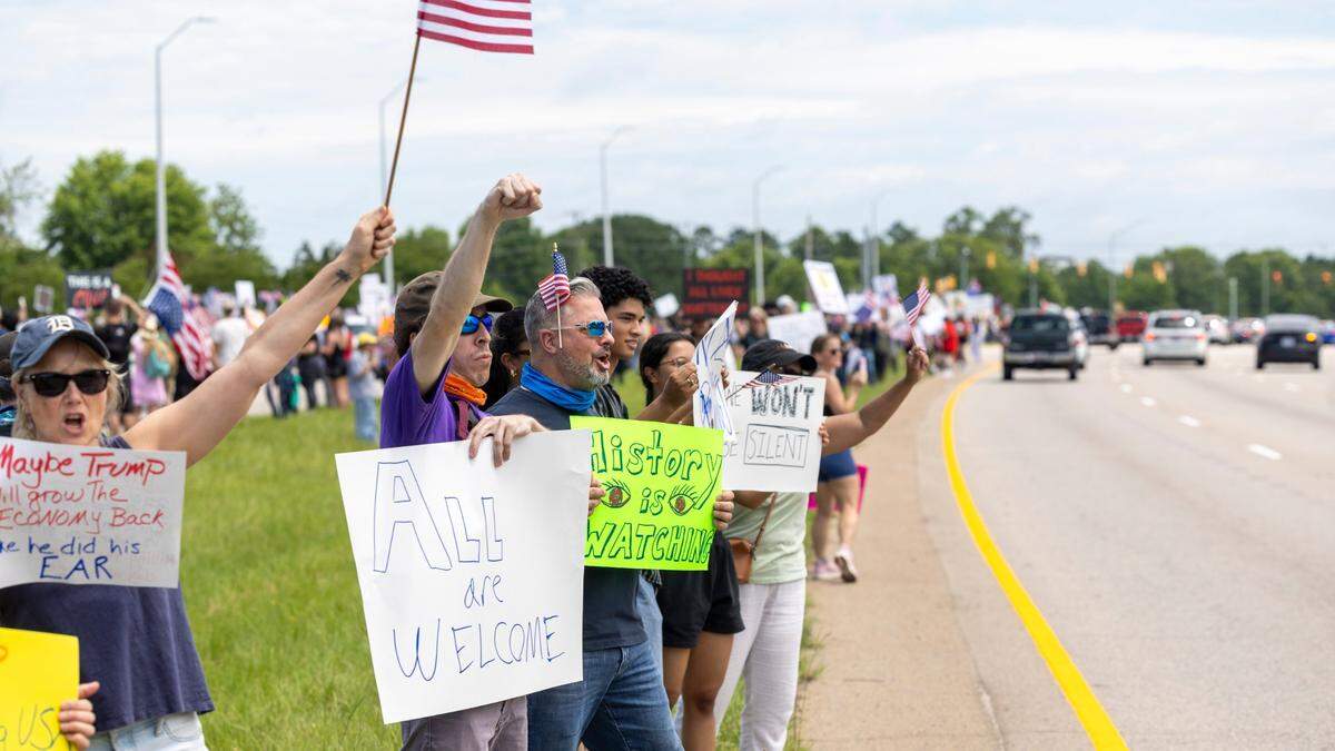 More than 1500 demonstrators lined Capital Boulevard to protest the policies and tactics of the of President Donald Trump on Saturday, June 14, 2025 near Triangle Town Center in Raleigh. The Raleigh “No Kings” rally was one of dozens across North Carolina and hundreds nationwide on what organizers called a nationwide day of defiance against the Trump administration.