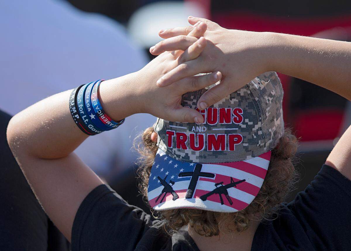 A person waits at Aero Center Wilmington prior to remarks by former President and current Republican candidate for president Donald Trump in Wilmington, N.C. on Saturday, Sept. 21, 2024.
