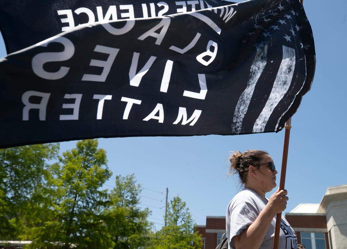 Dorothy Langston of Elizabeth City, N.C. carries her Black Lives Matter flag during a press conference at the Pasquotank Public Safety Building where Rev. Dr. William J. Barber II called for the United States Justice Department to do a full investigation of the Pasquotank County Sheriff’s office, and the district attorney in the handling of the death of Andrew Brown Jr. on Friday, May 21, 2021 in Elizabeth City, N.C.