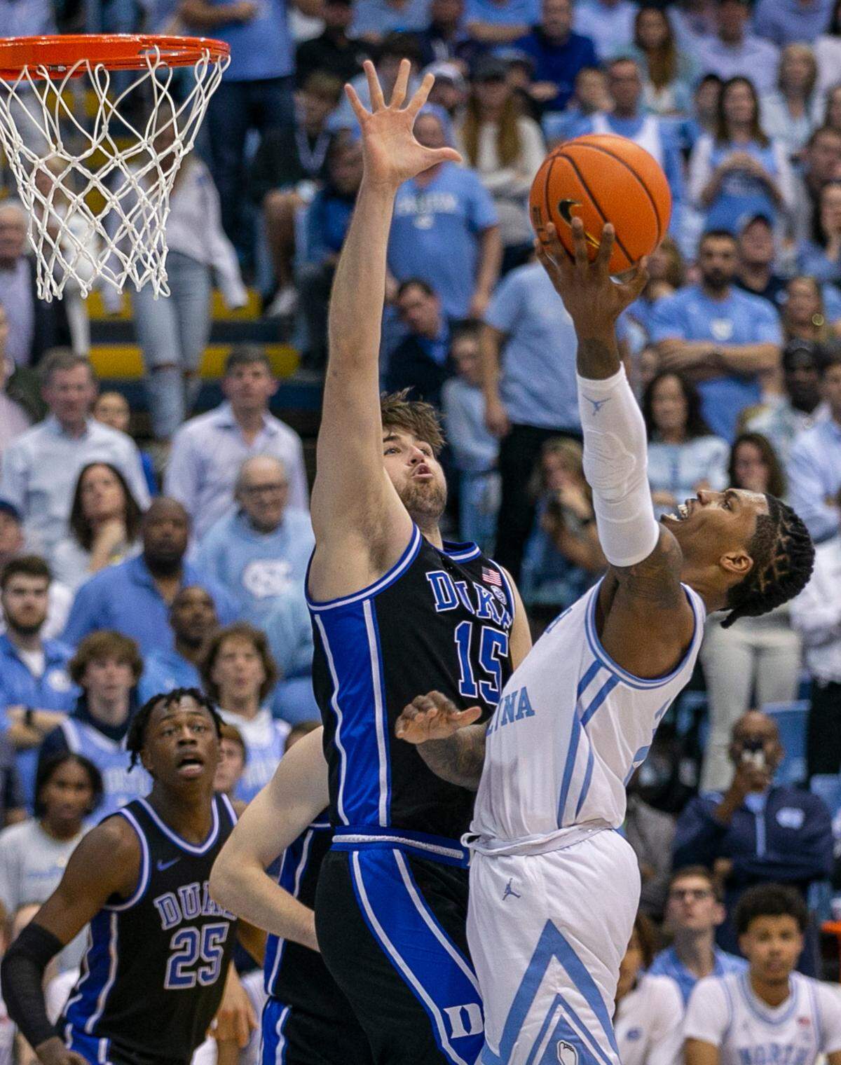 Duke’s Ryan Young (15) defends North Carolina’s Caleb Love (2) in the second half on Saturday, March 4, 2023 at the Smith Center in Chapel Hill, N.C.