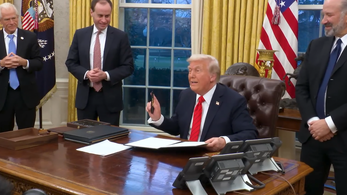 President Donald Trump signs an executive order Monday, Feb. 10, 2025, regarding the use of paper straws in the federal government.