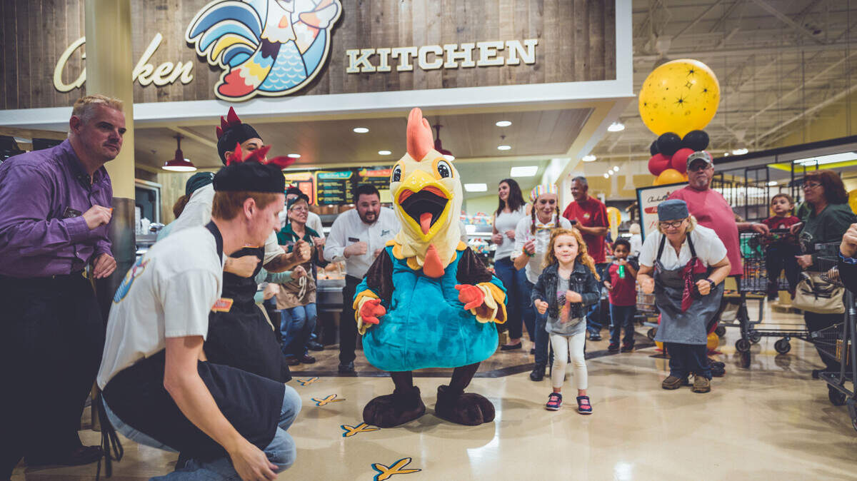 The chicken dance at a special Chicken Kitchen celebration at a Lowes Foods store. Photo taken before the COVID-19 pandemic.