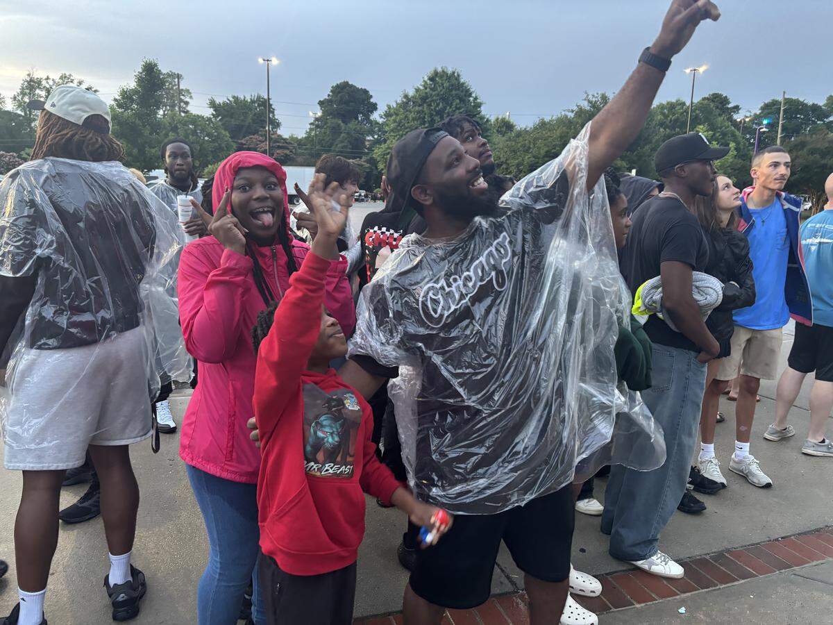 Brian Futrell with his children Briana, 14, and Nasir, 7, before the Beast Games taping in Greenville, N.C. on May 24, 2026.