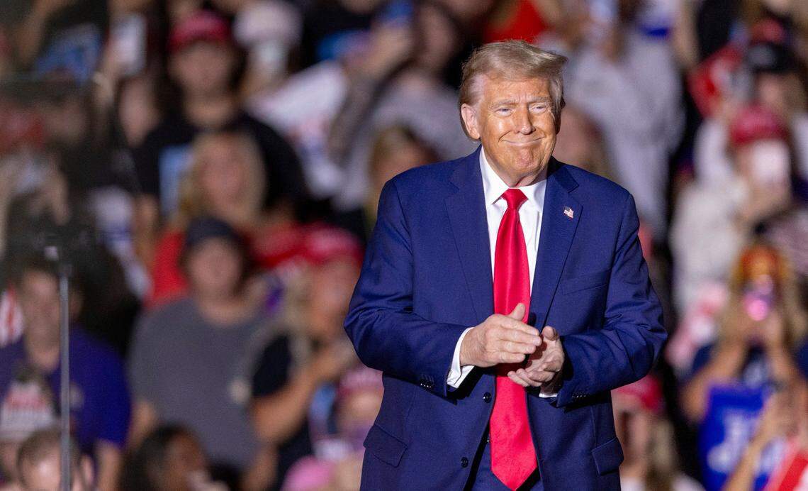 Former President Donald Trump takes the stage during a rally at Minges Coliseum in Greenville on Monday, Oct. 21, 2024. With two weeks until Election Day, Trump went on a three-city tour, in which Trump will also see the destruction caused by Hurricane Helene in Asheville and speak at a faith conference in Concord.