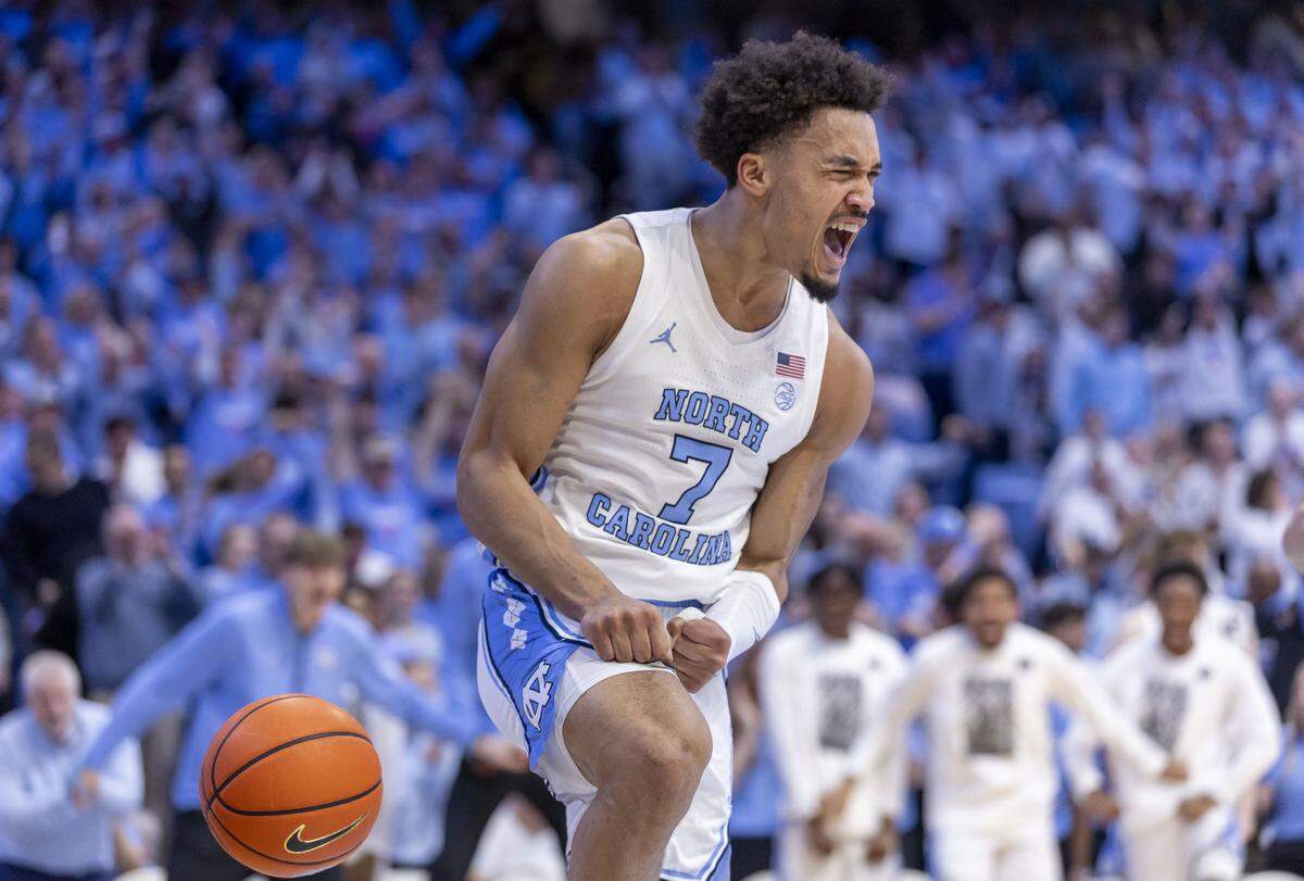 North Carolina guard Seth Trimble (7) reacts after a break away dunk in the second half against Louisville on Monday, February 23, 2026 at the Smith Center in Chapel Hill, N.C. Trimble led all scores with 30 points in the Tar Heels’ 77-74 victory.