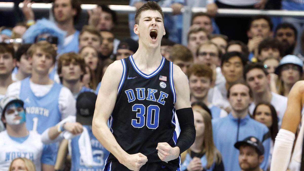 Duke’s Kyle Filipowski (30) celebrates after making the basket while being fouled during the first half of UNC’s game against Duke at the Smith Center in Chapel Hill, N.C., Saturday, March 4, 2023.