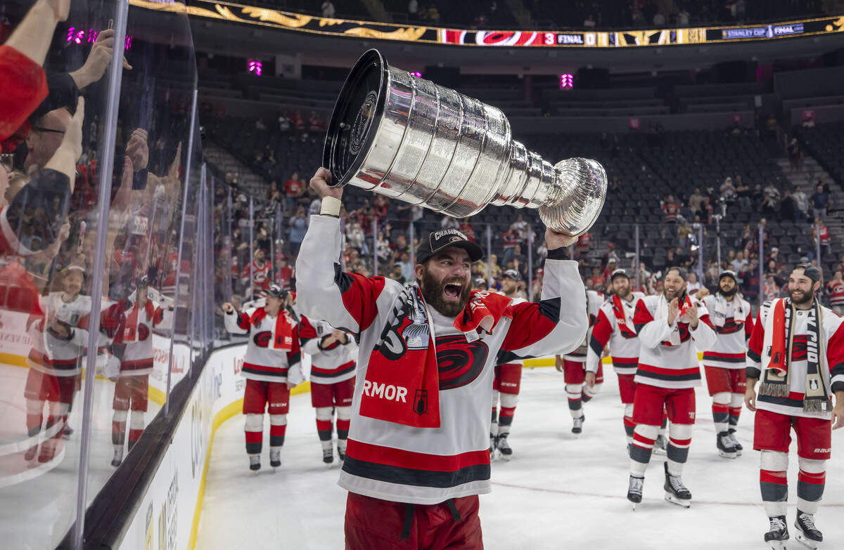 Carolina Hurricanes left wing Jordan Martinook (48) skates with the Stanley Cup following a 3-0 victory over Vegas in Game 6, on Sunday, June 14, 2026 at T-Mobile Arena in Las Vegas, NV.
