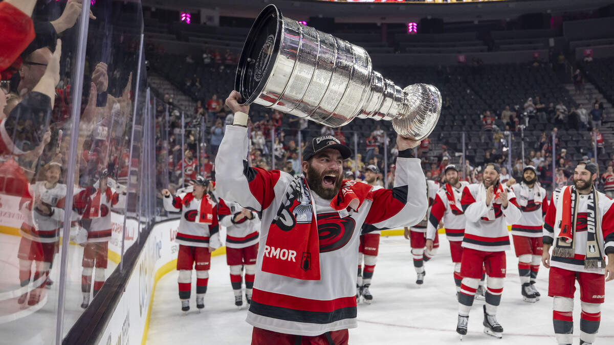 Carolina Hurricanes left wing Jordan Martinook (48) skates with the Stanley Cup following a 3-0 victory over Vegas in Game 6, on Sunday, June 14, 2026 at T-Mobile Arena in Las Vegas, NV.