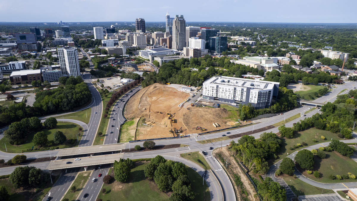 An aerial view on July 7, 2026, shows construction underway on a prominent piece of land at the south end of downtown Raleigh known as the City Gateway district.