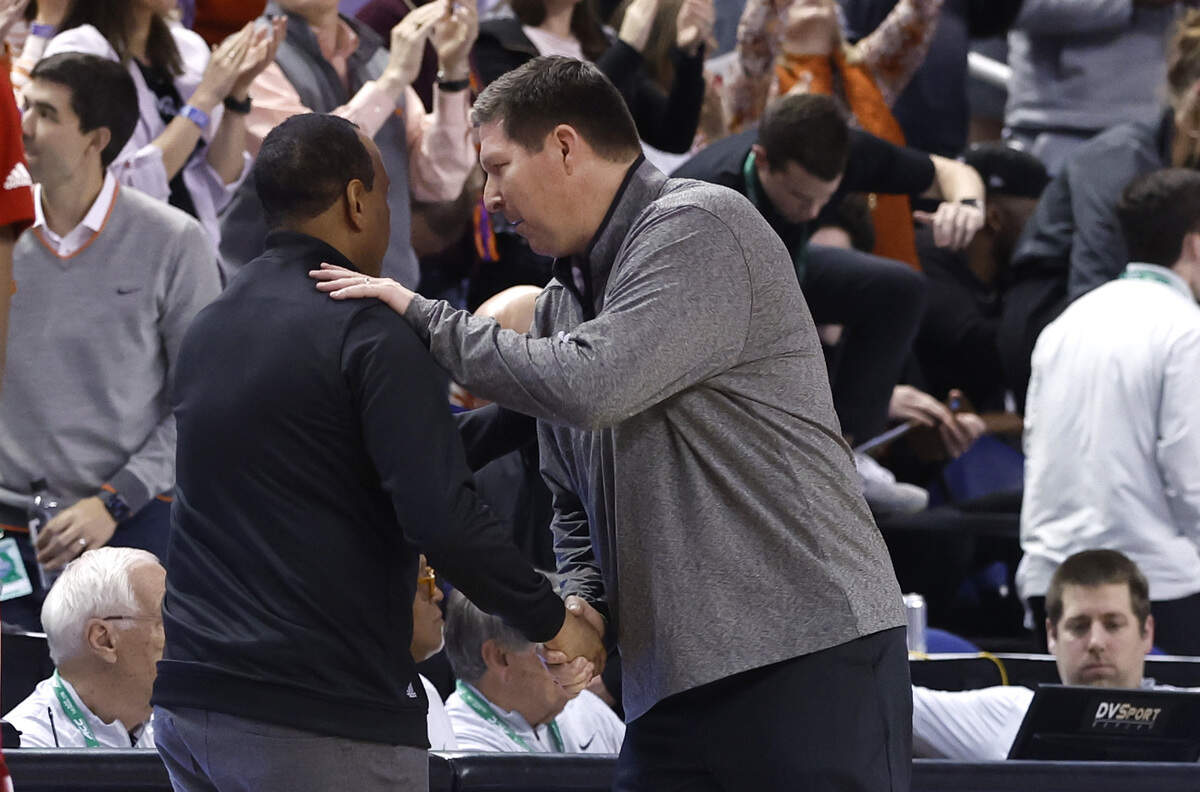 Clemson head coach Brad Brownell talks with N.C. State head coach Kevin Keatts after Clemson’s 80-54 victory over N.C. State in the quarterfinals of the ACC Men’s Basketball Tournament in Greensboro, N.C., Thursday, March 9, 2023.