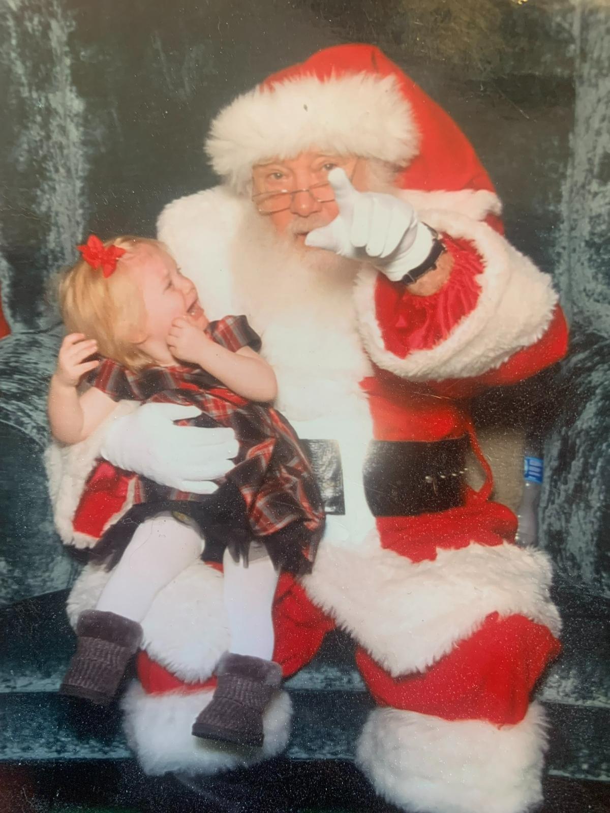 Suzanne Magnus’ Kinsley with Santa.