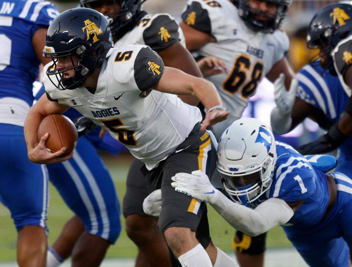 Duke Blue Devils defensive back Darius Joiner tackles North Carolina A&T Aggies quarterback Eli Brickhandler during the first half of Dukes game against North Carolina A&T at Wallace Wade Stadium in Durham, N.C. on Saturday, Sept. 17, 2022.