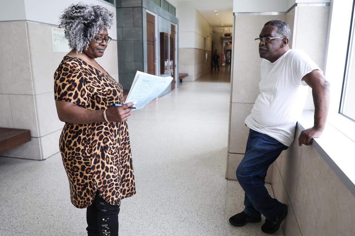 Rosemary Abram, left, and John Abram, right, stand outside of a magistrate's office at the Durham County Courthouse after a hearing about their eviction on Monday May 21, 2018. The magistrate ruled in favor of Artesia Morehead Portfolio I LLC, but gave the Abrams ten more days to vacate the property.