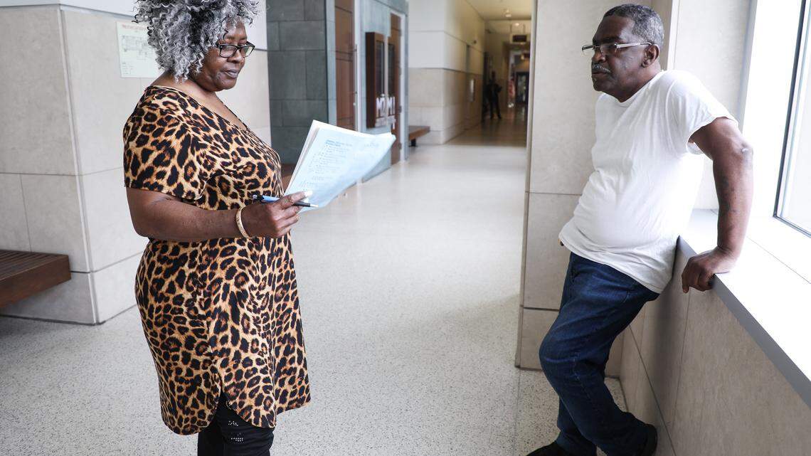 Rosemary Abram, left, and John Abram, right, stand outside of a magistrate's office at the Durham County Courthouse after a hearing about their eviction on Monday May 21, 2018. The magistrate ruled in favor of Artesia Morehead Portfolio I LLC, but gave the Abrams ten more days to vacate the property.