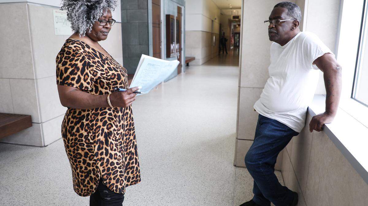 Rosemary Abram, left, and John Abram, right, stand outside of a magistrate's office at the Durham County Courthouse after a hearing about their eviction on Monday May 21, 2018. The magistrate ruled in favor of Artesia Morehead Portfolio I LLC, but gave the Abrams ten more days to vacate the property.