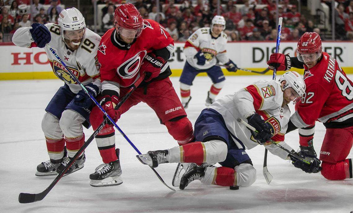 The Florida Panthers Sam Bennett (9) battles with the Carolina Hurricanes Jesperi Kotkaniemi (82) during a face-off in the first period during Game 2 of the Eastern Conference Finals on Saturday, May 20, 2023 at PNC Arena in Raleigh, N.C.