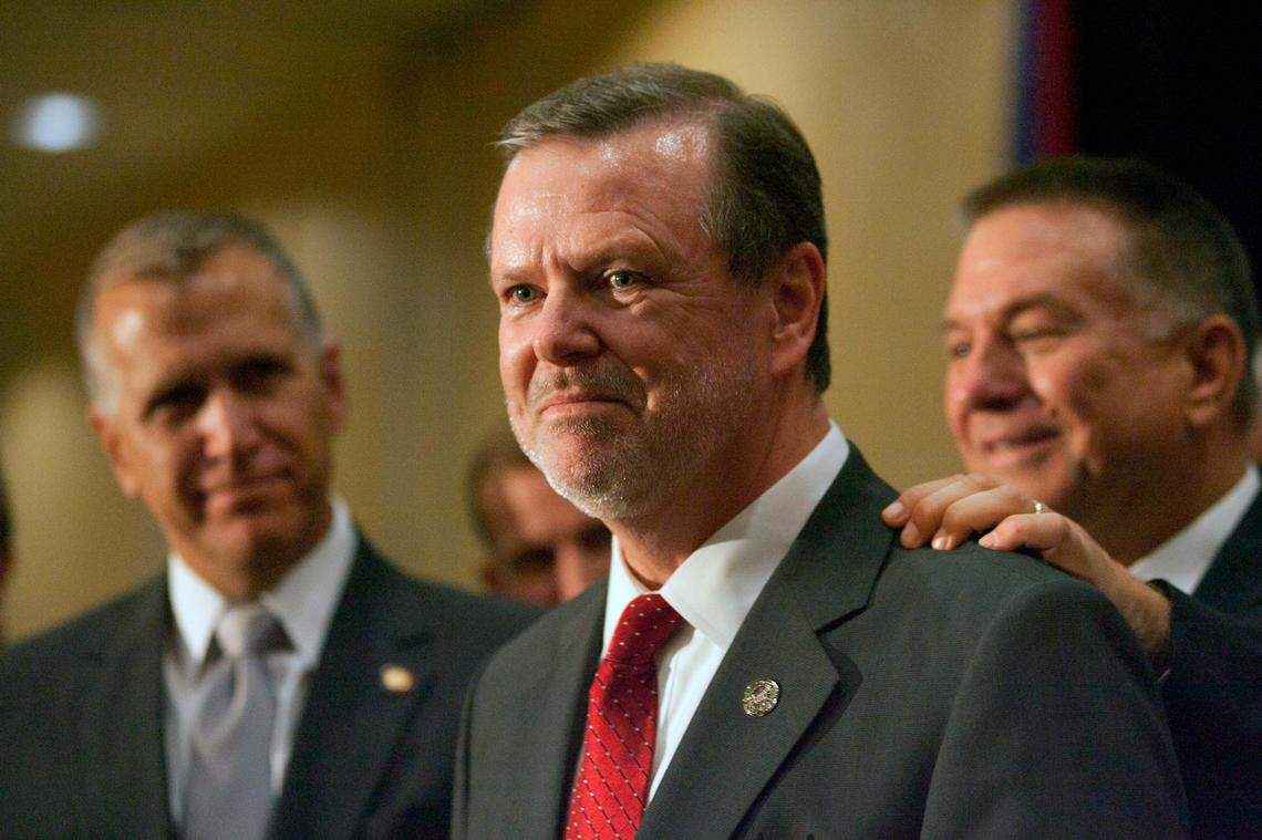 Then-House Republican leader Paul ‘Skip’ Stam, right, places his hand on the shoulder of Senate Republican leader Phil Berger as they celebrate with Rep. Thom Tillis, left, their party’s legislative victory on Nov. 4, 2010.
