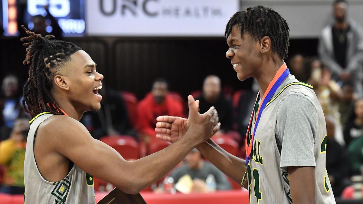 Central Cabarrus’ Jaiden Thompson (3) and Desmond Kent, Jr. celebrate after winning their awards after their defeat of Northwood in the NCHSAA 3A championship. The Northwood Chargers and the and the Central Cabarrus Vikings met in the NCHSAA 3A Championship Game in Raleigh, NC on March 11, 2023.