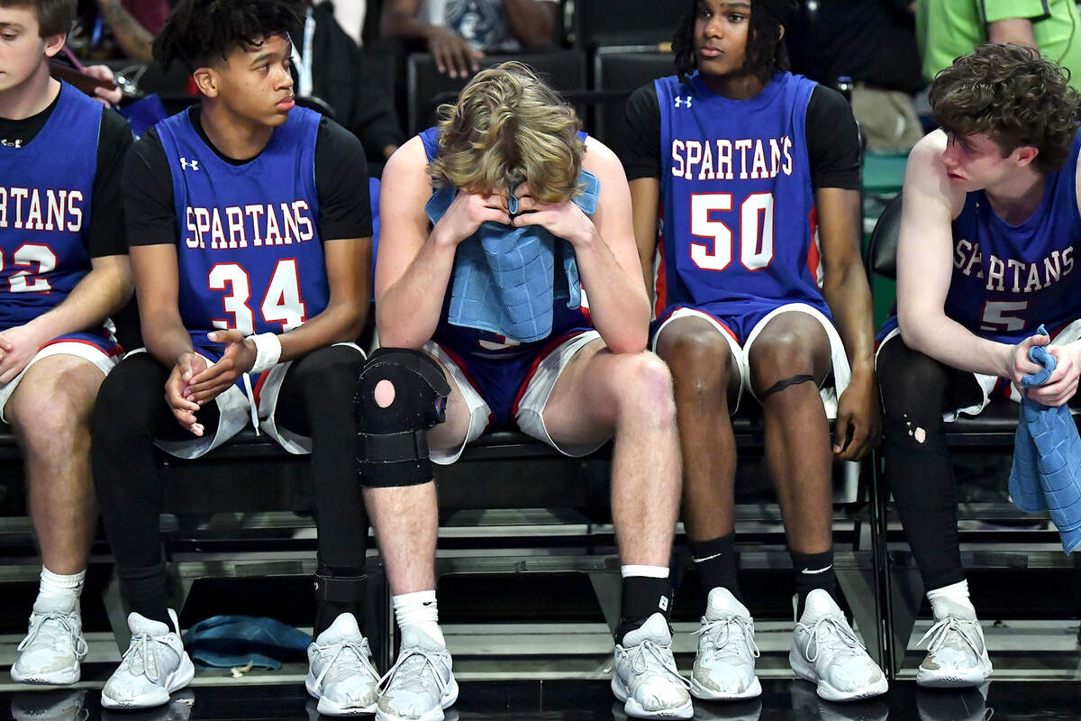 Sanderson’s Benjamin Ellison (3) reacts on the bench after his team’s loss to New Hanover in the East Regional Final. The Sanderson Spartans and the New Hanover Wildcats met in the NCHSAA 4A East Regional Final in Winston-Salem, N.C. on March 12, 2025.