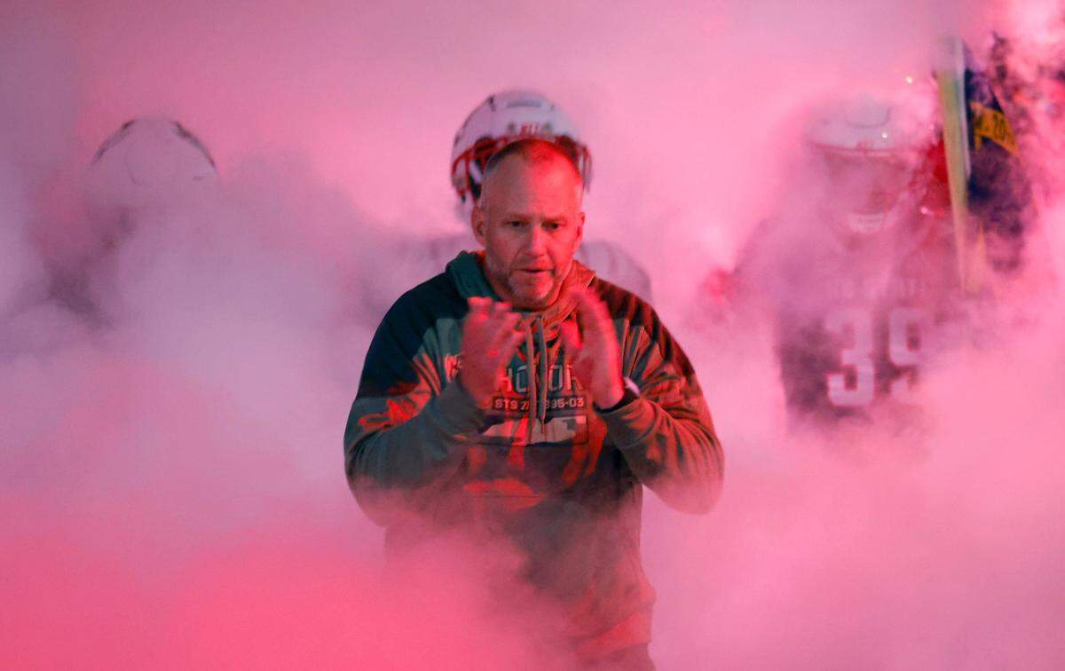 N.C. State head coach Dave Doeren heads onto the field with the team before N.C. State’s game against Virginia Tech at Carter-Finley Stadium in Raleigh, N.C., Thursday, Oct. 27, 2022.