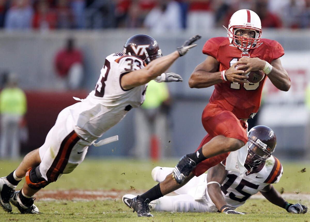 NCSU’s Russell Wilson, running against Virginia Tech in October, has been the Pack’s leader for three seasons. Ethan Hyman - ehyman@newsobserver.com