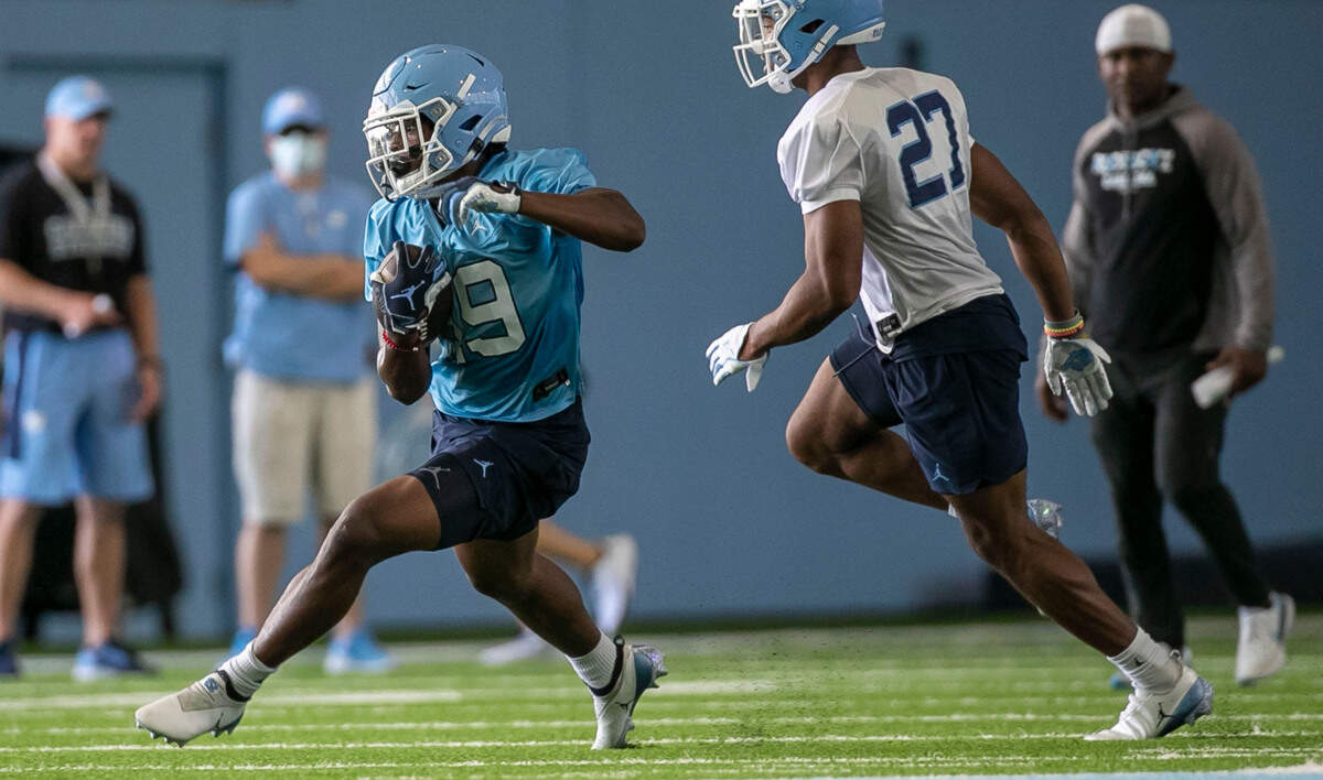 North Carolina running back Ty Chandler (19) carries the ball during the Tar Heels’ first day of practice on Thursday, August 5, 2021 in Chapel Hill N.C.