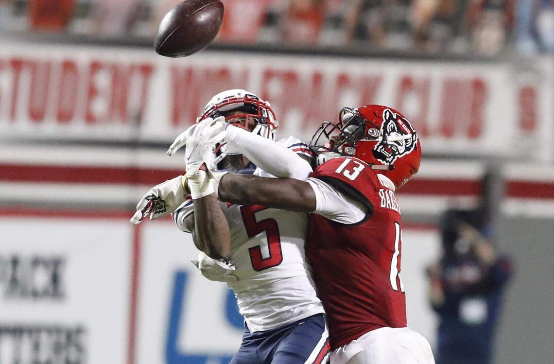 N.C. State defensive back Tyler Baker-Williams (13) breaks up a pass intended for Liberty wide receiver DJ Stubbs (5) during the second half of N.C. State’s 15-14 victory over Liberty at Carter-Finley Stadium in Raleigh, N.C., Saturday, Nov. 21, 2020.