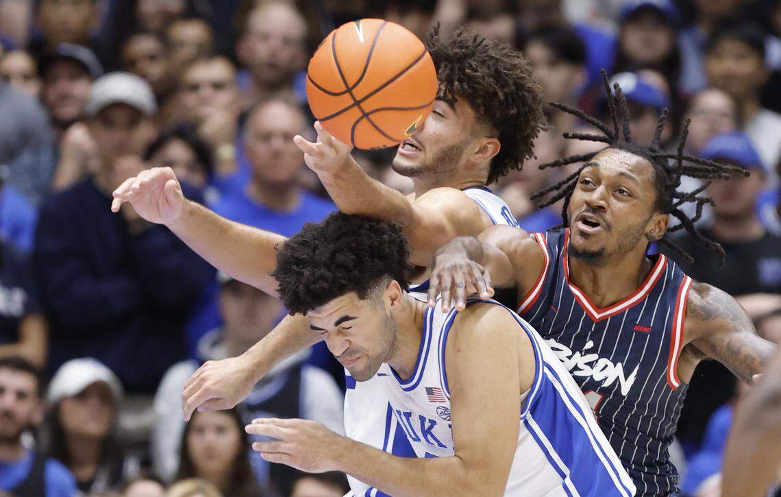 Duke’s Cayden Boozer (2) and Cameron Boozer (12) fight for the rebound with Howard's Bryce Harris (34) during the first half of Duke’s game against Howard at Cameron Indoor Stadium in Durham, N.C., Sunday, Nov. 23, 2025.