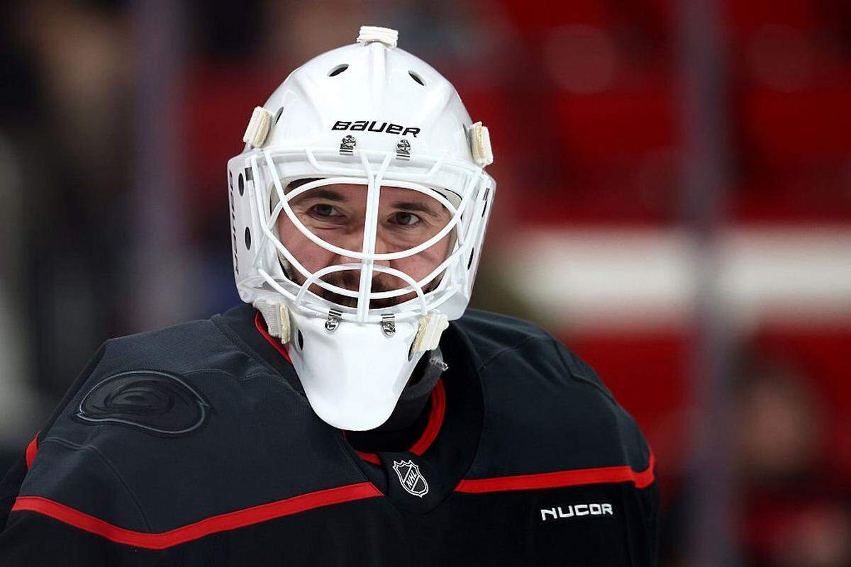 Brandon Bussi of the Carolina Hurricanes looks on prior to the game against the New Jersey Devils at Lenovo Center on October 09, 2025 in Raleigh, North Carolina.