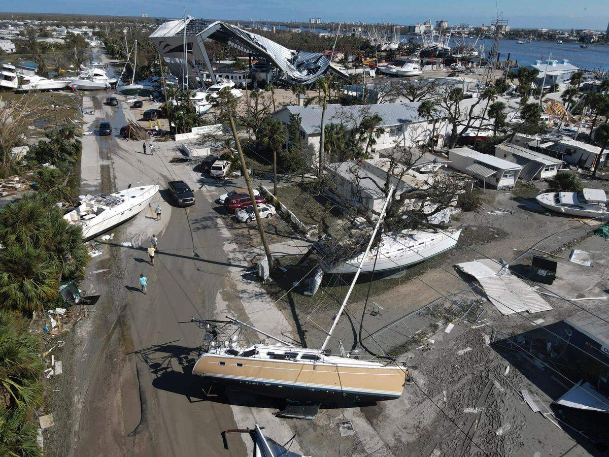 Boats lie scattered amidst mobile homes after the passage of Hurricane Ian, in the San Carlos area of Fort Myers Beach, Fla., Thursday, Sept. 29, 2022.