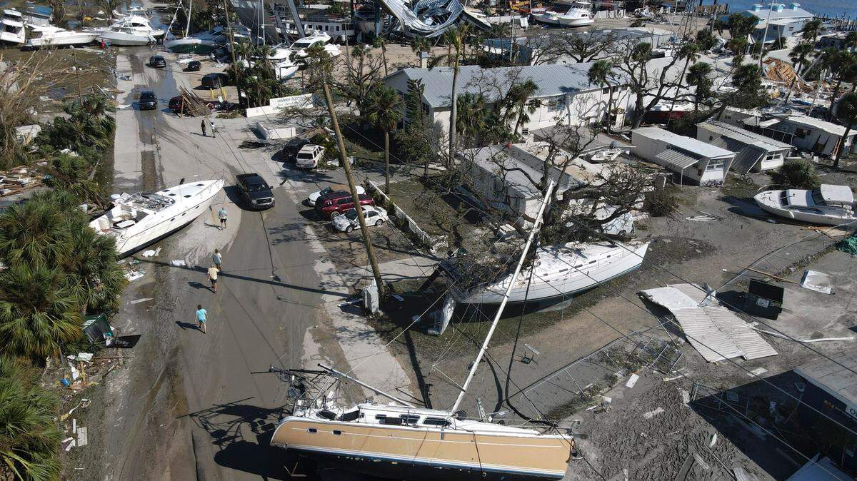 Boats lie scattered amidst mobile homes after the passage of Hurricane Ian, in the San Carlos area of Fort Myers Beach, Fla., Thursday, Sept. 29, 2022.