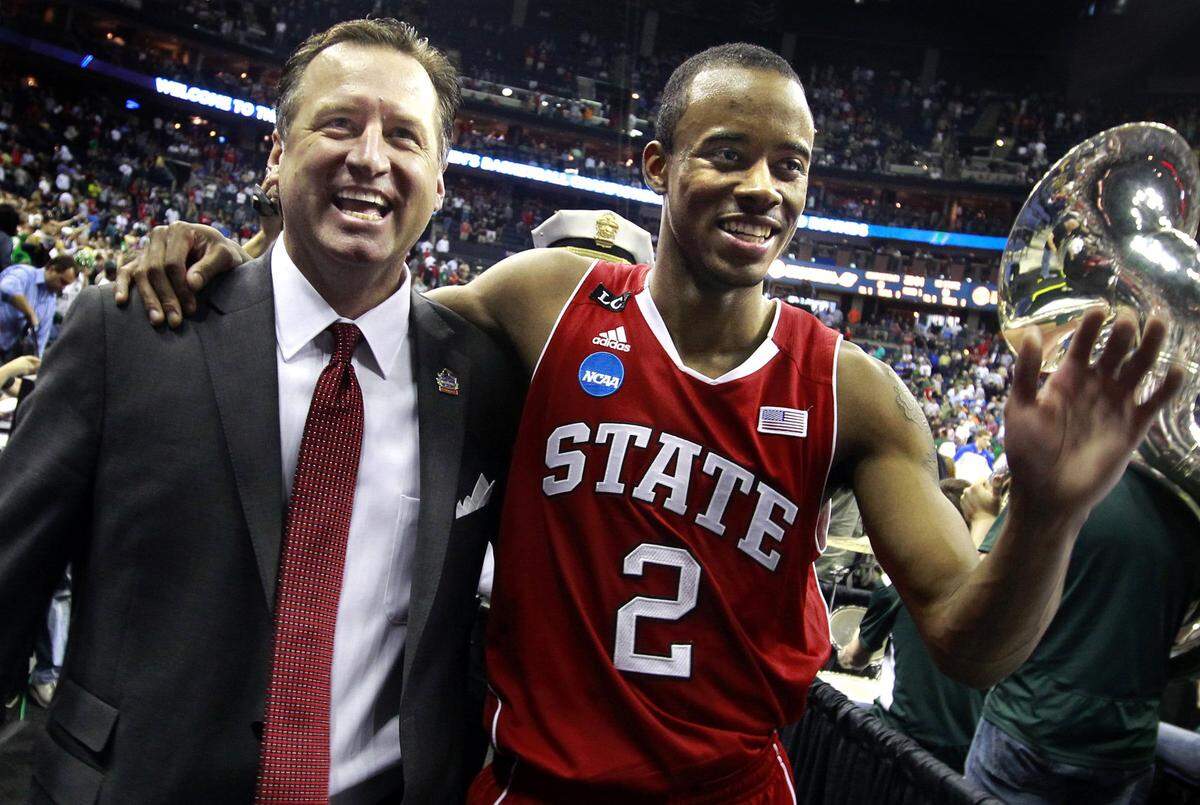 N.C. State’s Mark Gottfried and Lorenzo Brown (2) walk off the court after N.C. State’s 66-63 victory over Georgetown in the third round of the NCAA Tournament at Nationwide Arena in Columbus, Ohio, Sunday, March 18, 2012.