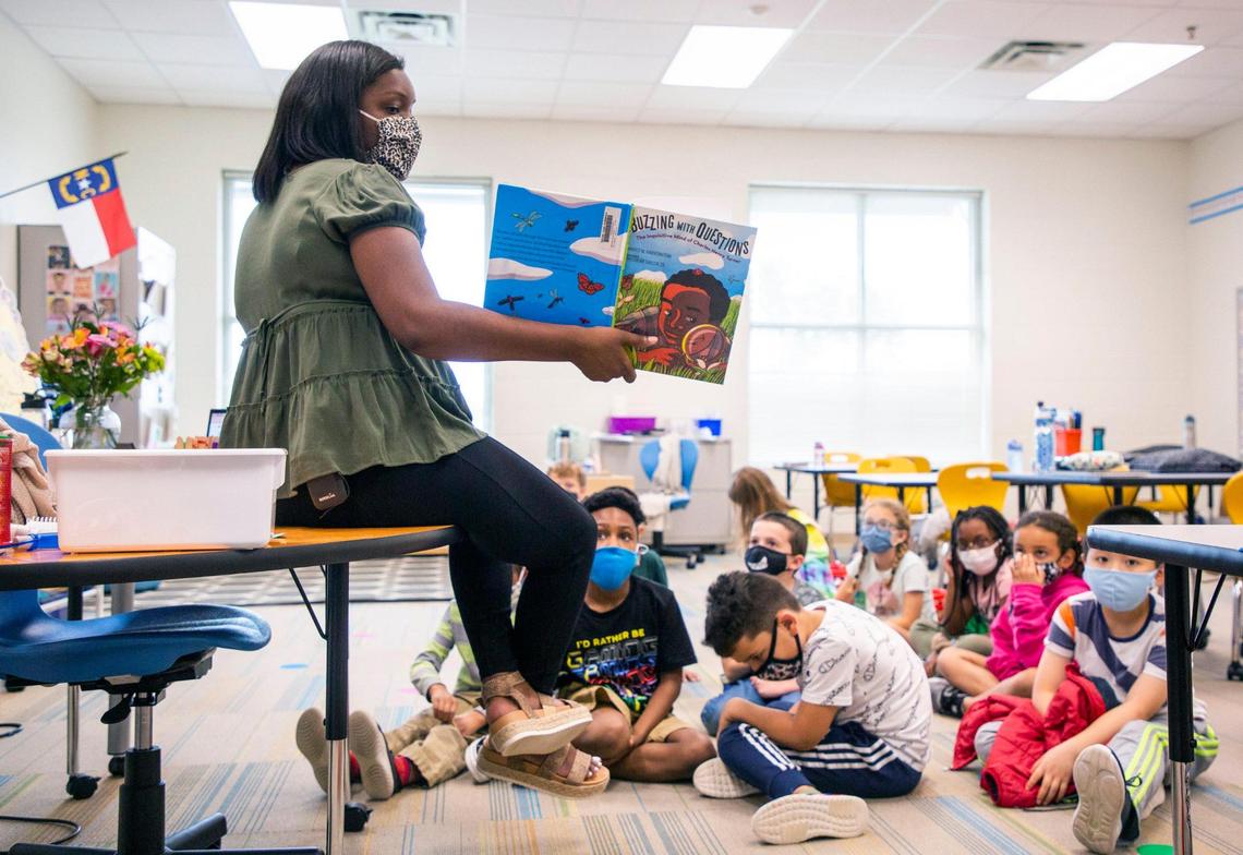 Bria Wright reads a book about Charles Henry Turner, a zoologist and the first African American to receive a graduate degree at the University of Cincinnati in 1892, to her second grade class at Hortons Creek Elementary School, on Thursday, May 6, 2021, in Cary, N.C.