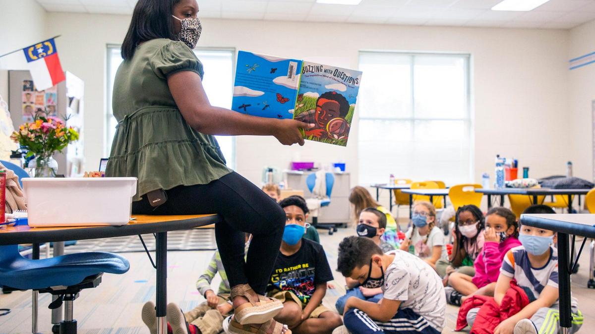 Bria Wright reads a book about pioneering African American scientist Charles Henry Turner to her second grade class at Hortons Creek Elementary School in Cary in May 2021.