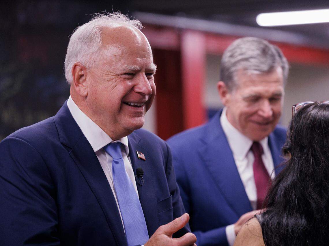 Democratic Vice Presidential nominee and Minnesota Gov. Tim Walz smiles during a visit to a campaign office with Gov. Roy Cooper in Raleigh, N.C. on Thursday, Aug. 29, 2024.