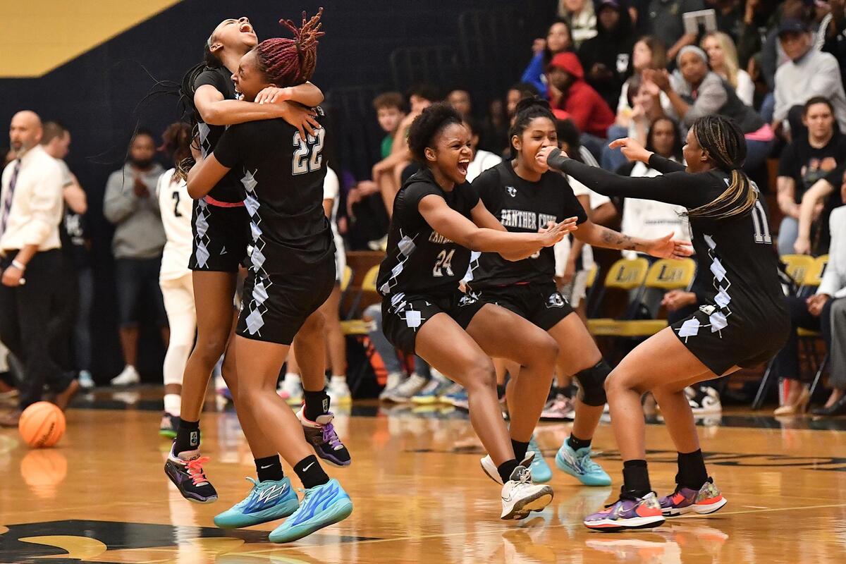 The Panther Creek Catamounts celebrate after their defeat of Hillside in the 4A East Regional Finals .The Hillside Hornets and the Panther Creek Catamounts met in the NCHSAA 4A East Regional Finals in Sanford, N.C. on March 4, 2023.
