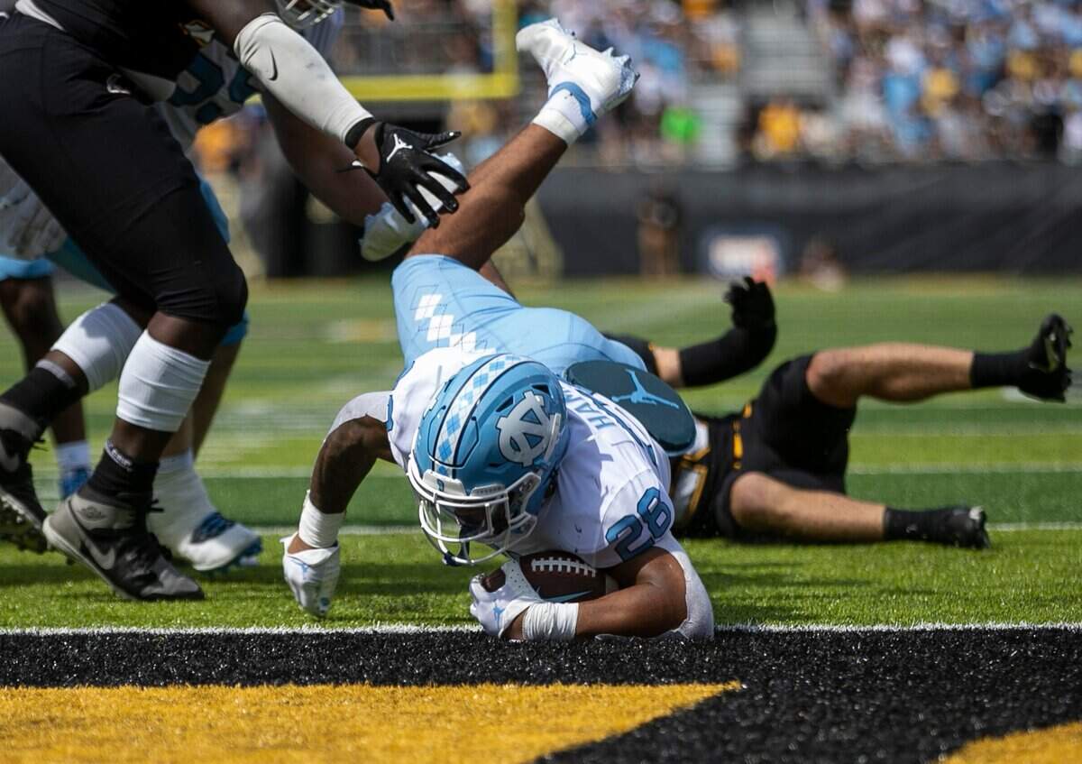 North Carolina’s Omarion Hampton (28) scores a touchdown on a two-yard run to give the Tar Heels a 49-35 lead in the fourth quarter on Saturday, September 3, 2022 at Kidd Brewer Stadium in Boone, N.C.