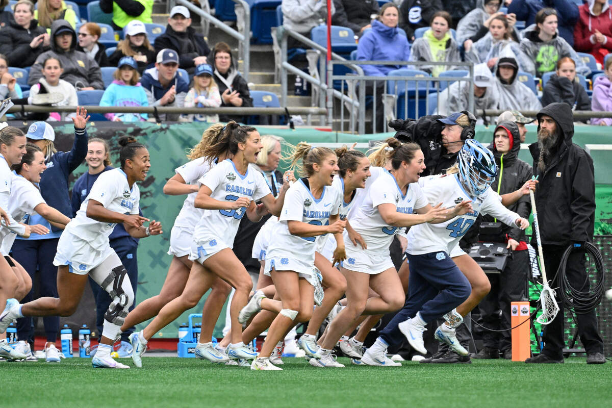 The North Carolina Tar Heels charge the field after defeating the Florida Gators at Gillette Stadium on Friday, May 23. On Sunday, May 25, the Tar Heels toppled Northwestern to win the NCAA national championship.